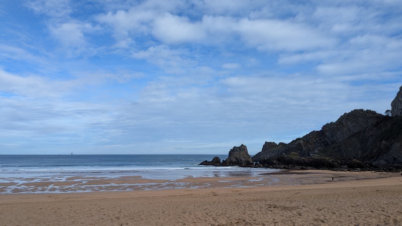 A wide view of Laga beach showing the sand, shoreline, and surrounding cliffs. — Lago (Urdaibai), Elantxobe, Autonomous Community of the Basque Country, Spain