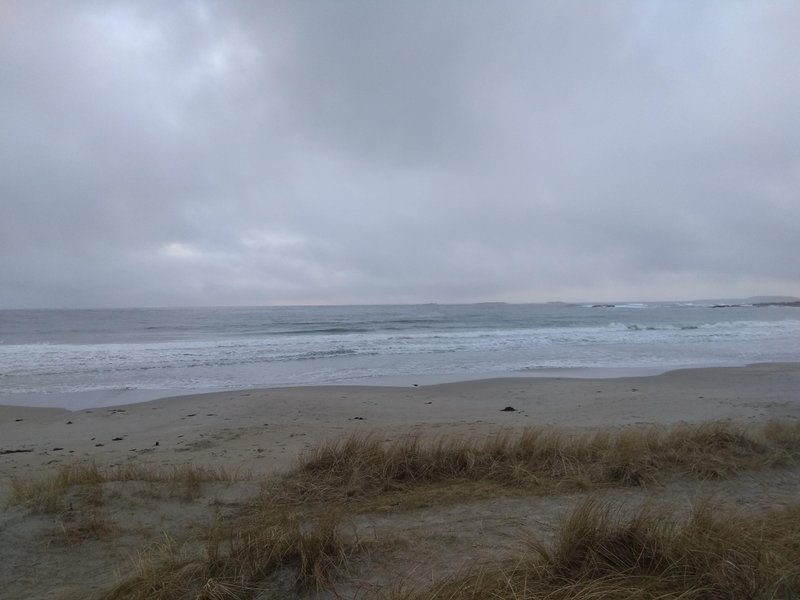 A view of the sandy beach and waves at Solastranden under an overcast sky. — Solastranden (Sola Coast), Sola, Norway