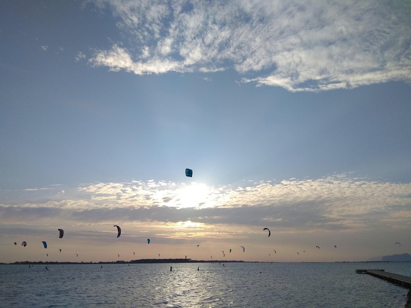 Numerous kites fly over the lagoon at Lo Stagnone during sunset. — Lo Stagnone (Marsala), Marsala, Sicily, Italy