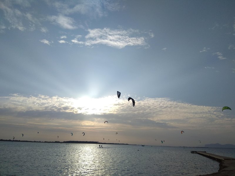 Numerous kitesurf wings fill the sky over the shallow lagoon at Lo Stagnone. — Lo Stagnone (Marsala), Marsala, Sicily, Italy