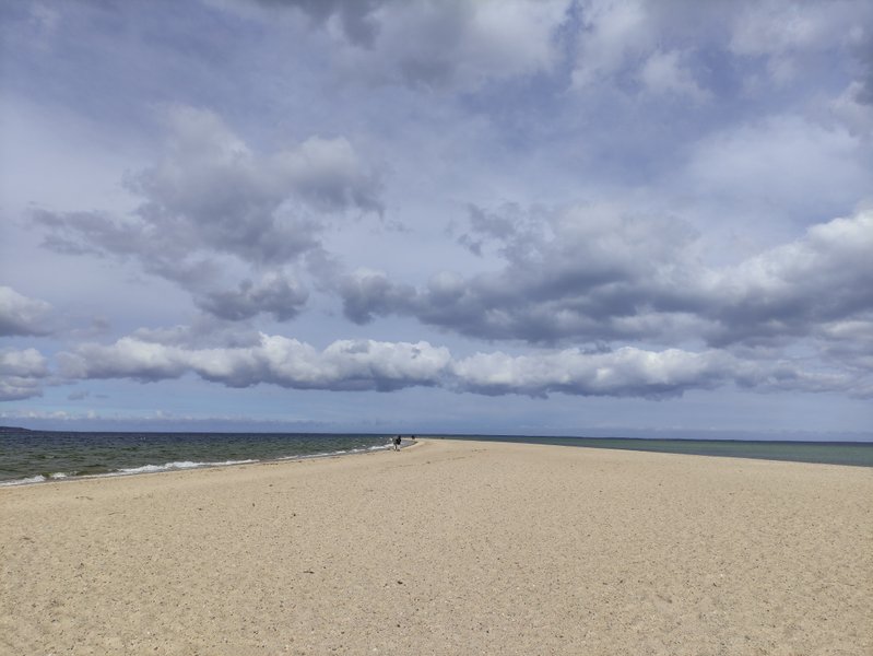 The sandy spit at Rewa extending into the sea under a cloudy sky. — Cypel (Rewa), Rewa, Pomeranian Voivodeship, Poland