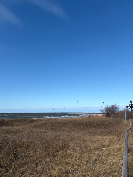 View of the sand spit at Rewa with kitesurfers in the distance. — Cypel (Rewa), Rewa, Pomeranian Voivodeship, Poland