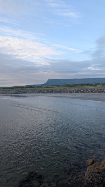 A view across the water at Rosses Point with Benbulben visible in the distance.