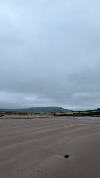 A wide sandy beach with distant hills under a cloudy sky. — Inch Reef, County Kerry, Kenmare Municipal District, Ireland