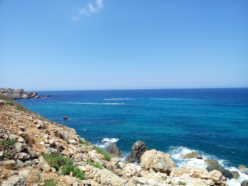 Wide view of the blue water and rocky coastline at Golden Bay. — Golden Bay (Manikata), Manikata, Malta