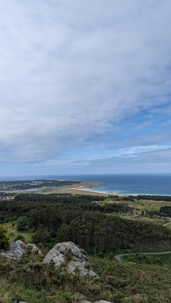 A wide landscape view looking down towards Playa de Ladeira and the surrounding coastline. — Playa de Ladeira (A Barbanza), Santa Uxía de Ribeira, Galicia, Spain