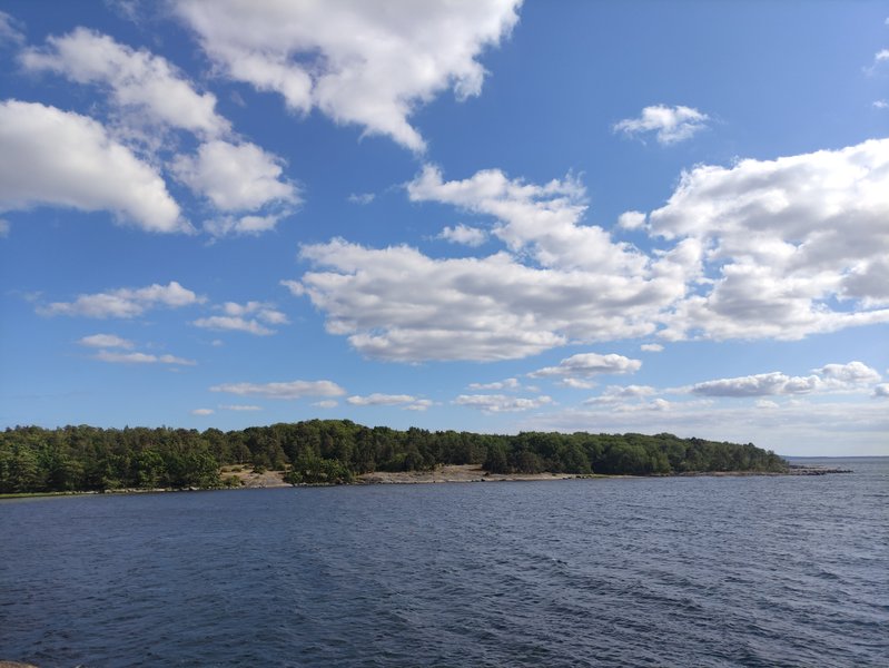 A wide view of the water and forested shoreline at Sternö. — Sternö Badplats (Karlshamn), Karlshamn, Sweden