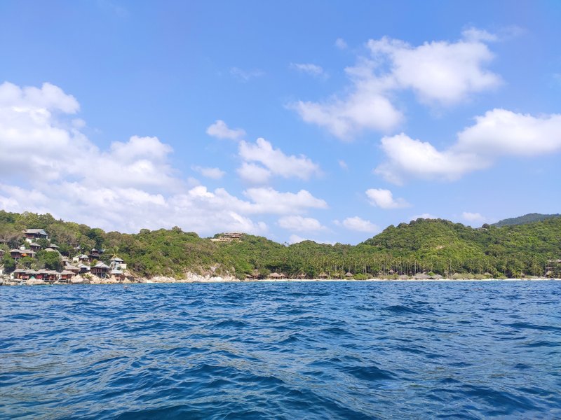View of Ao Thian Ok bay from the water, showing the coastline and forested hills. — Ao Thian Ok (Ko Tao), Ko Pha-ngan District, Thailand
