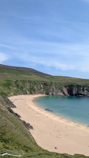 An aerial view of the sandy Silver Strand beach with clear blue water and green cliffs. — Silver Strand (Malin Beg), Malin Beg, Donegal Municipal District, Ireland