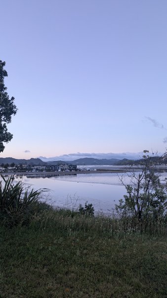 A wide landscape view of the Tairua estuary under a twilight sky. — Playa de Tairua, Tairua, Waikato, New Zealand
