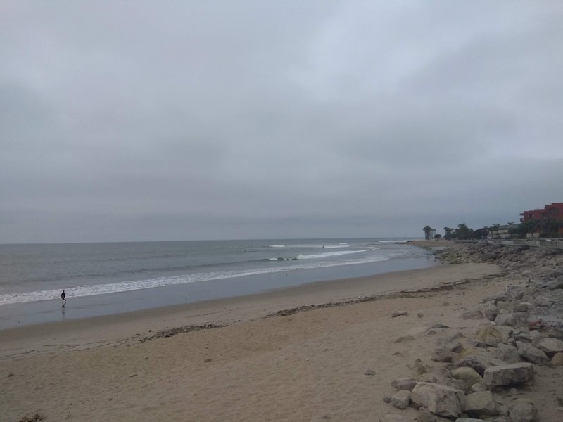 A view of the coastline at San Buenaventura State Beach on a cloudy day.