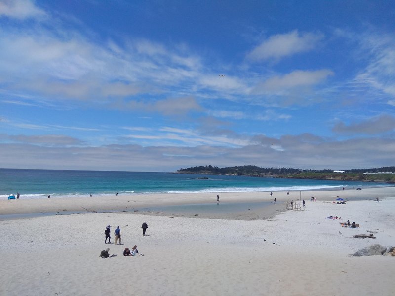 A wide view of Carmel Beach showing the white sand and blue water under a partly cloudy sky. — Carmel Beach (Carmel-by-the-Sea), Carmel-by-the-Sea, California, United States