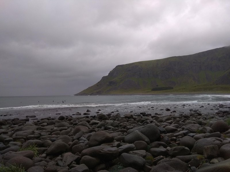 A view across the rocky shoreline towards the surf at Unstad beach. — Unstad (Lofoten), Unstad, Norway