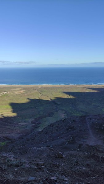 A wide landscape view of Cofete Beach and the Atlantic Ocean from the surrounding mountains. — Cofete (Praia de Cofete), Cofete, Canary Islands, Spain