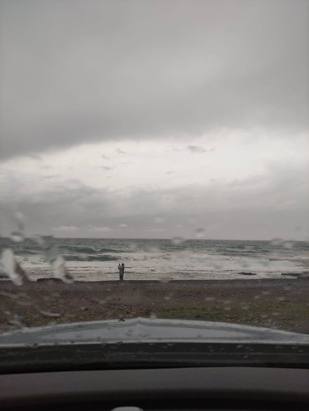 A view of the shoreline and choppy water at Peristeras through a rainy car windshield. — Peristeras (Ierapetra Bay), Ierapetra Municipal Unit, Greece