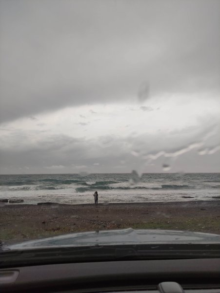 A view of the beach and sea at Peristeras through a rainy car windshield. — Peristeras (Ierapetra Bay), Ierapetra Municipal Unit, Greece