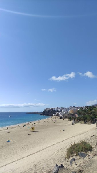A wide view of Playa de Salinas beach and the coastline under a clear blue sky. — Playa de Salinas (Jandía), Pájara, Canary Islands, Spain