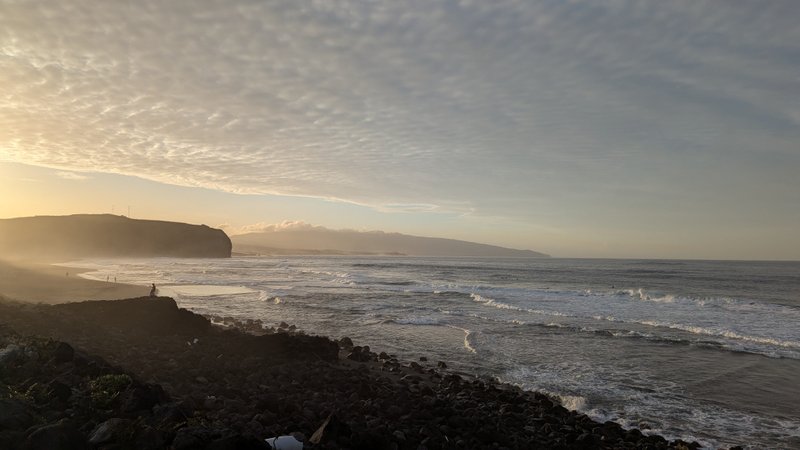 A wide view of the surf and rocky coastline at Praia de Santa Bárbara under a sunset sky. — Praia Santa Barbara (Ribeira Grande), Ribeira Grande (Conceição), Portugal